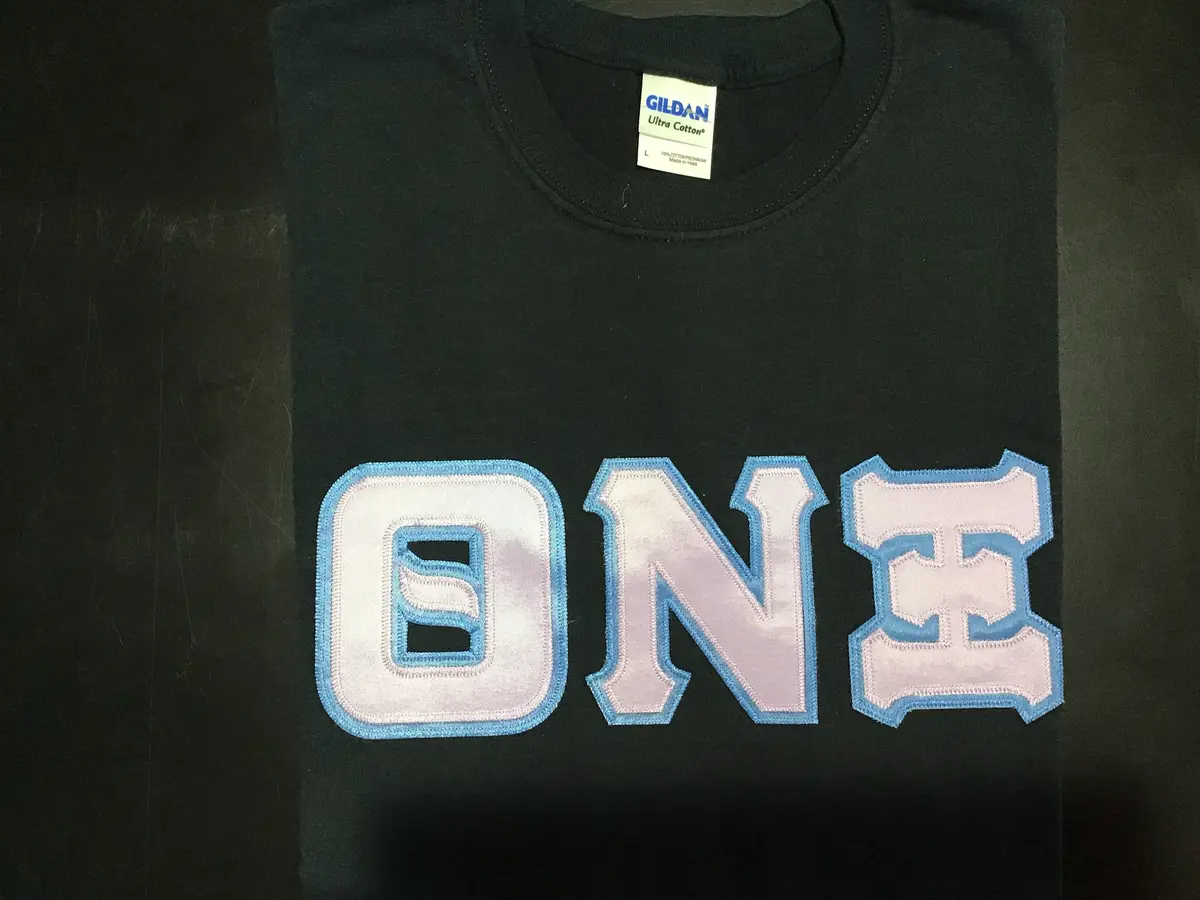 Theta Nu Xi Black Greek Tee 1