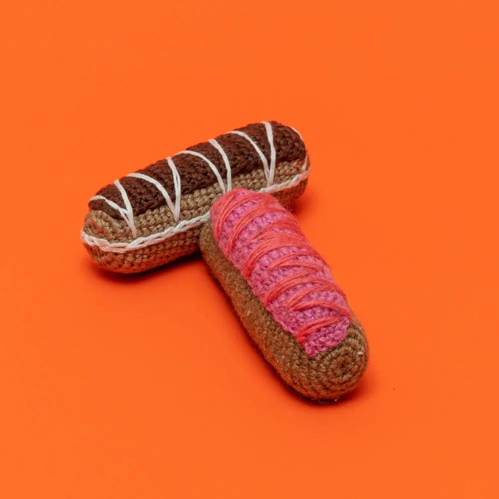 Ware Of The Dog | Cotton Crochet Eclair Toy In Strawberry 1